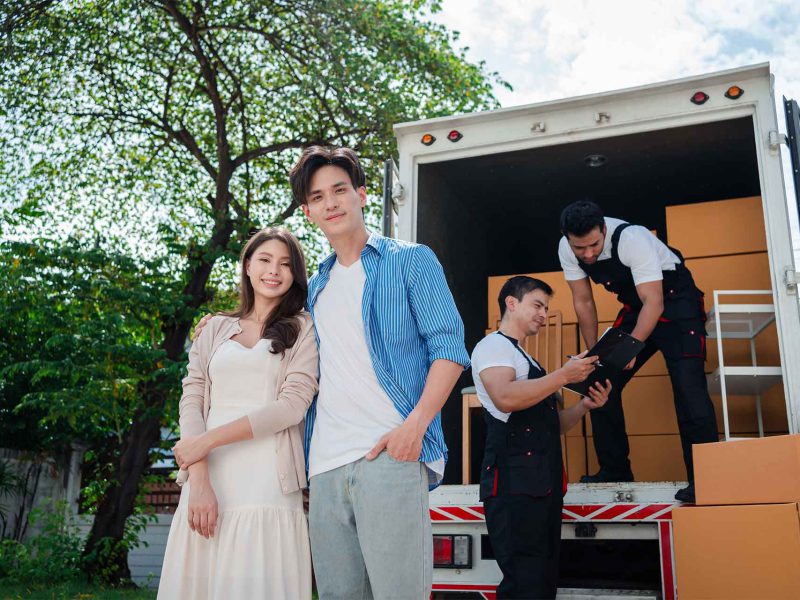 asian-couple-check-while-unloading-boxes-and-furni-2023-11-27-05-02-49-utc